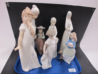 Lot 1307 - Nao Figurines, two in nightdresses 28cm high,...