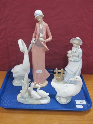 Lot 1223 - Four Nao Figures, along with one similar...