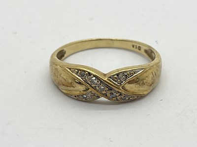 Lot 86 - A 9ct Gold Diamond Set Ring, of crossover...