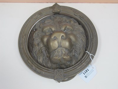 Lot 1411 - Brass door knocker in the form of a lions head...