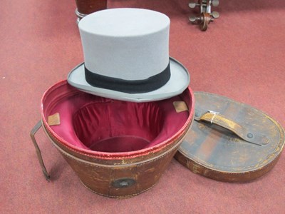 Lot 1386 - Moss Bros Grey Top Hat, size 7¼, with leather box