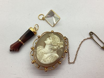 Lot 50 - A Polished Hardstone Charm Pendant, as a...