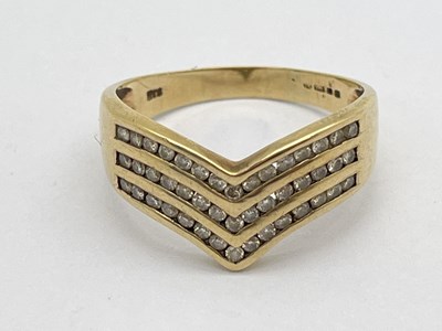 Lot 75 - A Modern Three Row Channel Set Diamond Ring,...