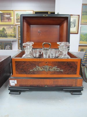 Lot 1468 - A four decanter tantalus with lift out fitted...