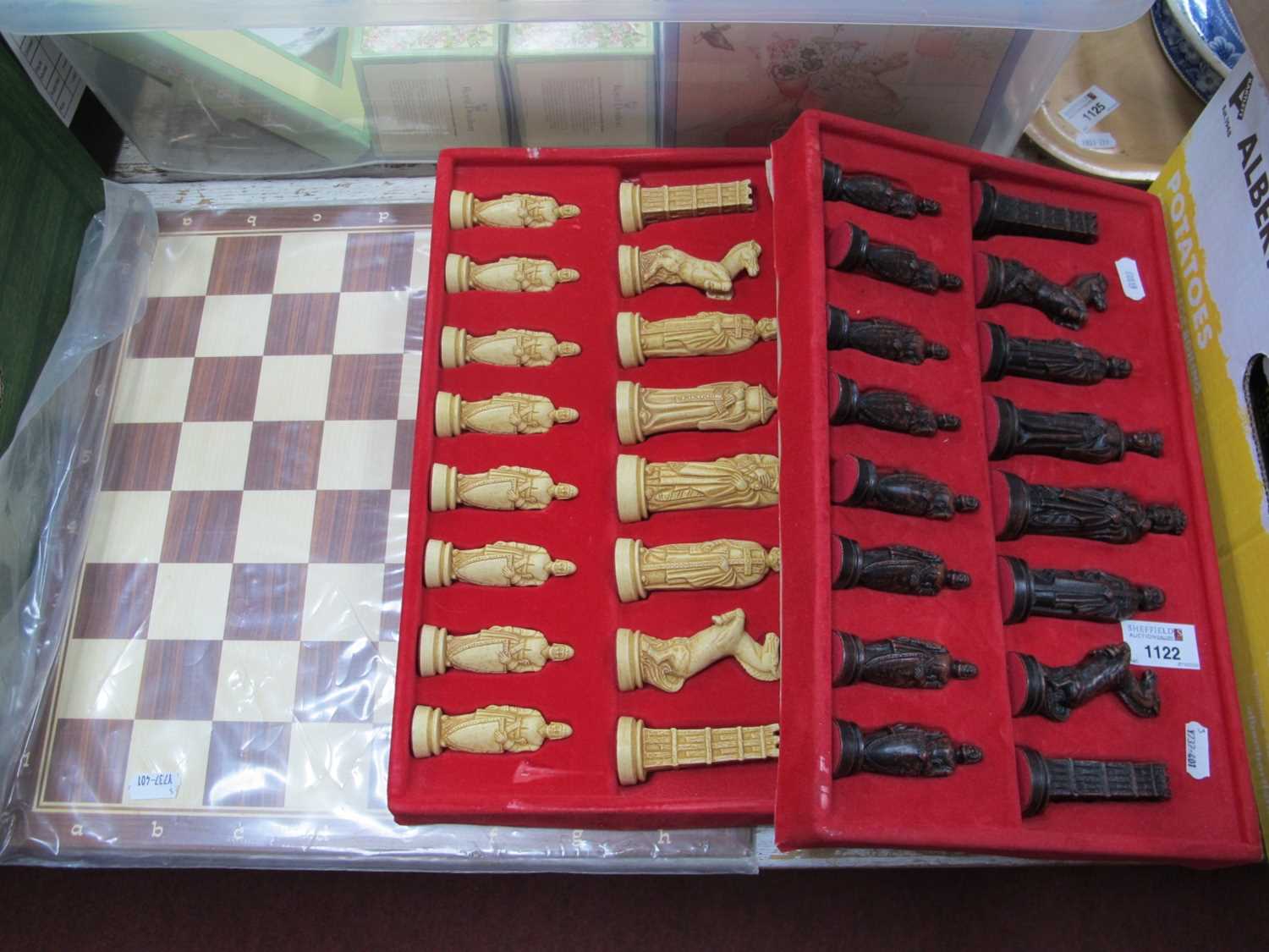 Lot 1122 - A chess set complete with board and resin...