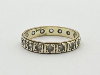 Lot 24 - A Stone Set Eternity Band, collet set within...