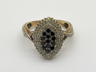 Lot 51 - A Diamond and Sapphire Set Dress Ring, of...