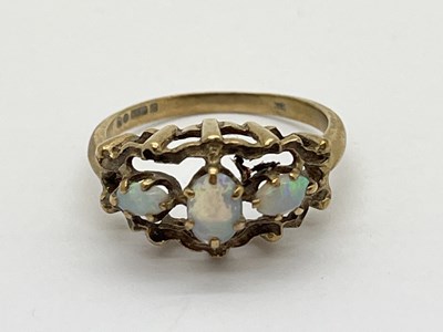 Lot 61 - A 9ct Gold Opal Three Stone Ring, the claw set...