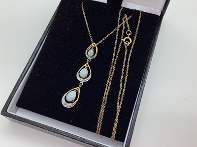 Lot 113 - A 9ct Gold Opal Set Pendant, of graduated drop...