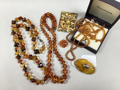 Lot 131 - A Collection of Amber Coloured Jewellery, to...