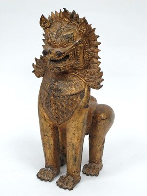 Lot 1133 - A Chinese Gilt Metal Model of a Temple Lion,...