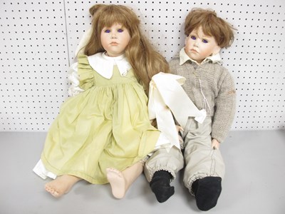 Lot 294 - Two Purple Eyed Bisque Dolls, the female with...