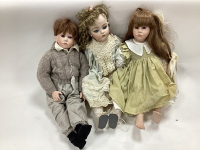 Lot 1342 - Two Purple Eyed Bisque Dolls, the female with...