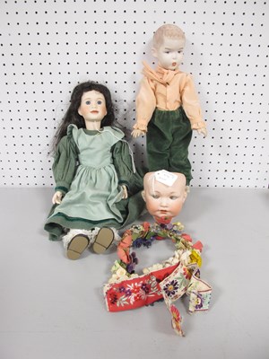 Lot 286 - Two Bisque Headed Dolls, the female with glass...