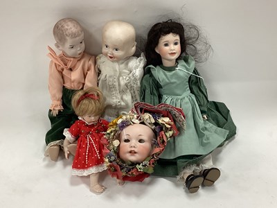 Lot 1341 - Two Bisque Headed Dolls, the female with glass...