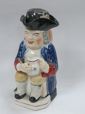 Lot 1292 - XIX Century Pottery Toby Jug, with black...