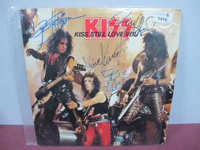 Lot 1410 - Kiss Authgrapsh, featuring four band members...