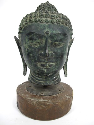 Lot 1139 - A Thai Bronze Buddha Head, raised and mounted...