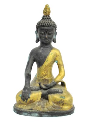 Lot 1135 - A Burmese Gilded Bronze Seated Buddha, 39cm high.