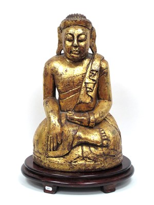 Lot 1308 - A Large Giltwood Carved Buddha, with oval...