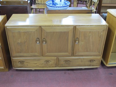 Lot 1636 - Ercol Sideboard, with three cupboard doors,...