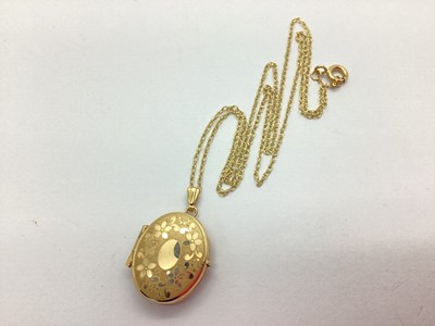 Lot 53 - A 9ct Gold Oval Locket Pendant, foliate...