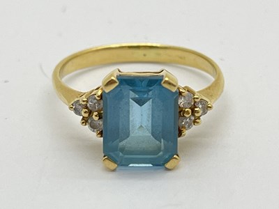 Lot 38 - A Blue Topaz and Diamond Dress Ring,...