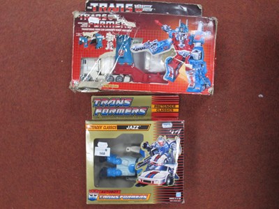 Lot 568 - Two boxed circa 1980's Transformers by Hasbro...