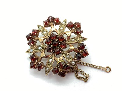 Lot 50 - A 9ct Gold Garnet and Seed Pearl Set Brooch,...