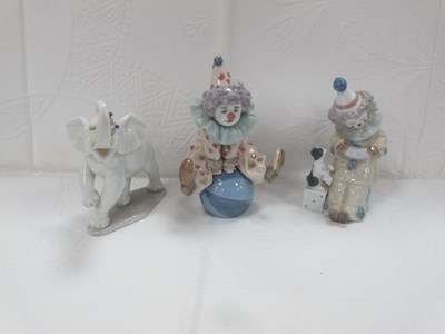 Lot 1264 - Lladro Clown on Ball, Clown with dog and...