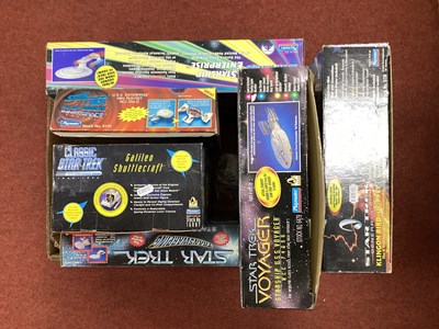 Lot 704 - Four Boxed Playmates Star Trek Themed Plastic...