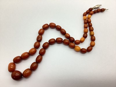 Lot 91 - A Graduated Amber Colour Single Strand Bead...