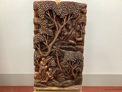 Lot 1140 - A Philippine Hardwood Panel, carved in relief...