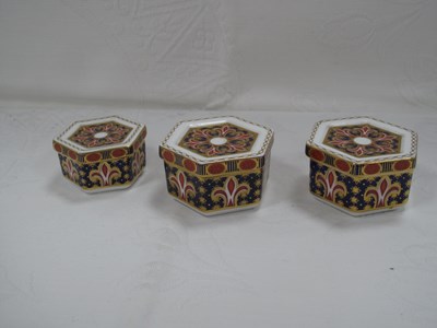 Lot 1335 - Royal Crown Derby Hexagonal Trinket Boxes...