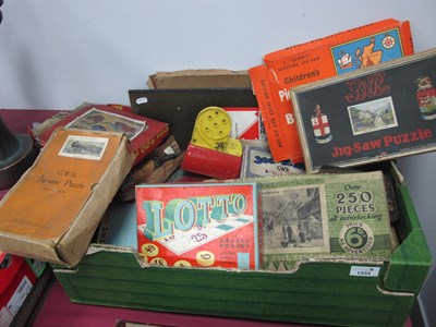 Lot 1334 - A collection of mid 20th century jigsaw...