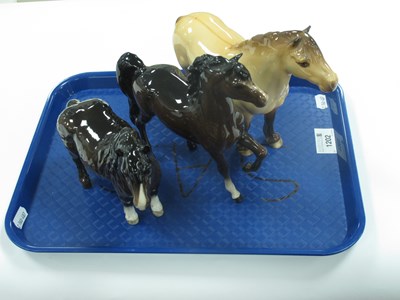 Lot 1202 - Beswick Highland Pony, Shetland Pony and one...