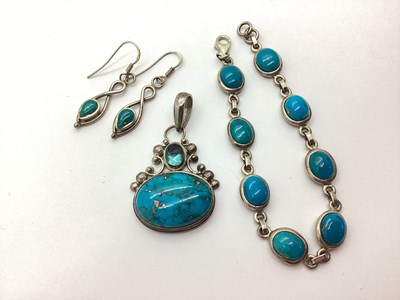 Lot 64 - A Modern Turquoise Inset Oval Pendant, stamped...