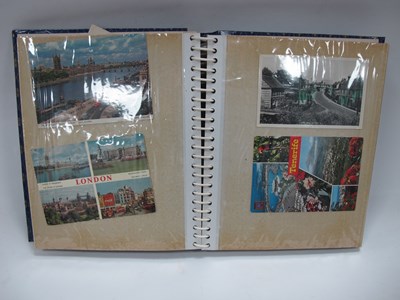 Lot 1358 - A postcard album filled with a mixture of...