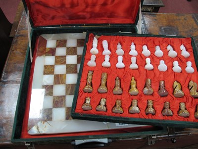 Lot 1389 - A mineral chess set and board, complete in...