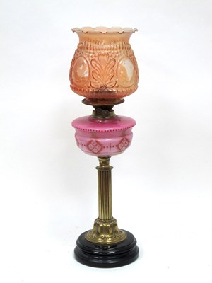 Lot 1305 - A Late Victorian Oil Lamp, with pink opaque...