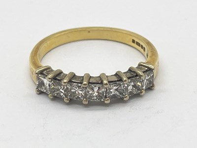 Lot 40 - An 18ct Gold Seven Stone Diamond Ring, square...