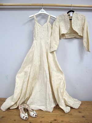 Lot 1378 - A 1950's Heavy Cream Embossed Fabric Wedding...