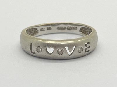 Lot 31 - An 18ct White Gold Diamond "LOVE" Ring, the...