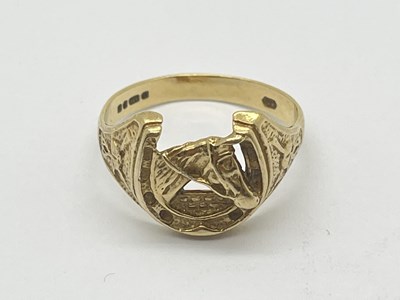 Lot 28 - A 9ct Gold Horseshoe Ring, with horse head...