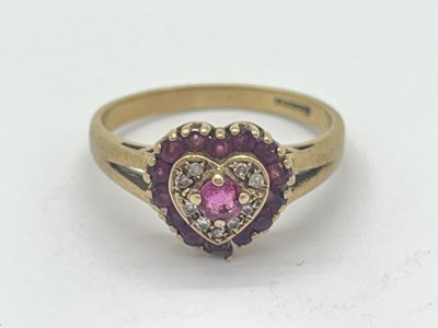 Lot 53 - A 9ct Gold Diamond and Ruby Heart Ring, of...