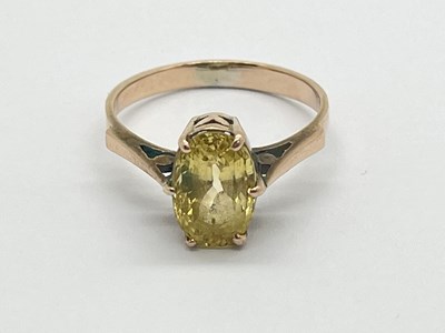 Lot 51 - An Oval Single Stone Dress Ring, claw set...