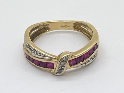 Lot 27 - A 9ct Gold Diamond and Ruby Crossover Ring, to...