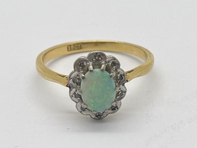 Lot 30 - An Opal and Diamond Cluster Ring, the oval...