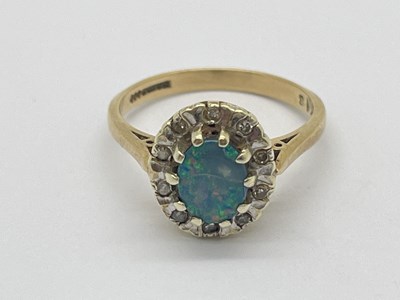 Lot 55 - A 9ct Gold Opal and Diamond Cluster Ring, the...