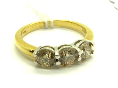 Lot 213 - A Modern 18ct Gold Three Stone Diamond Ring,...